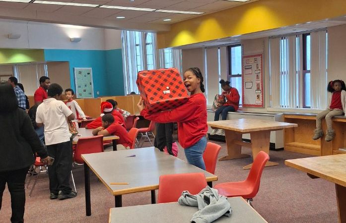  A Student Smiles with Her Gift